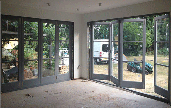 two sets of bi-fold doors on tracks
